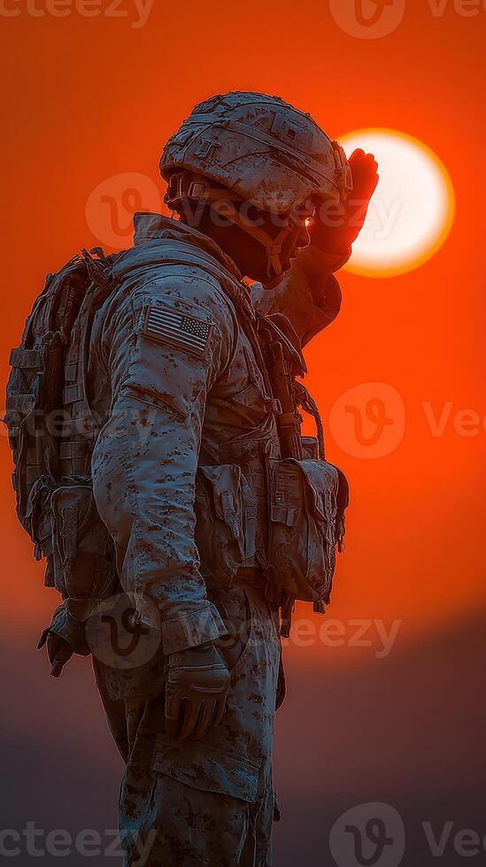 Soldier saluting during sunset in a desert setting highlighting duty and honor photo