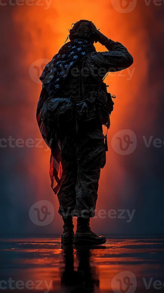 Silhouette of soldier saluting against vibrant background during twilight photo