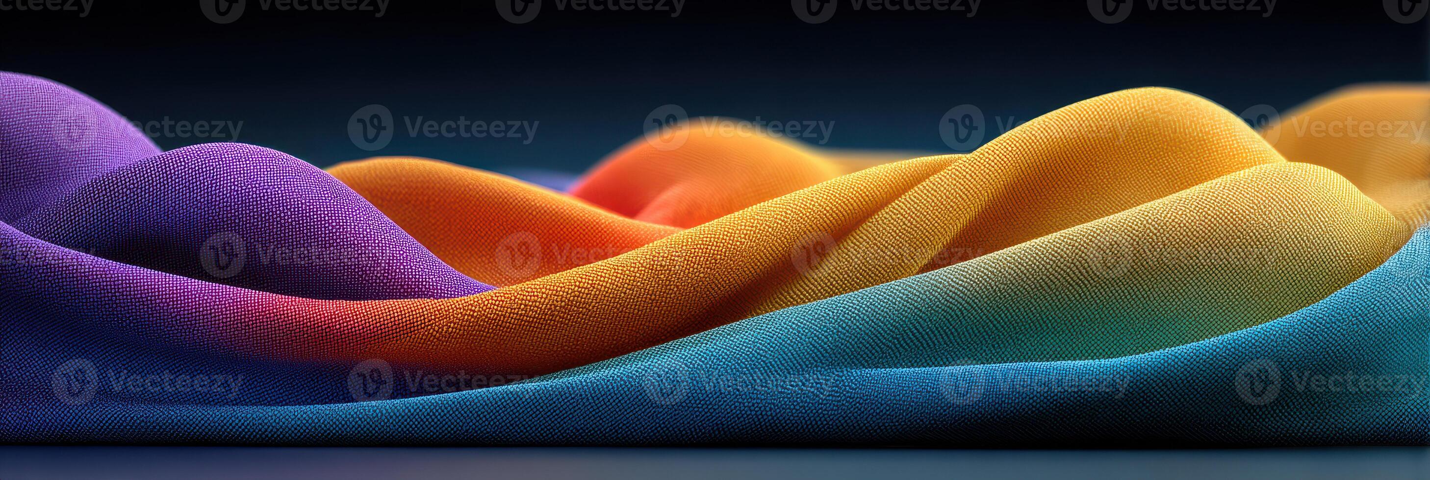 Colorful fabric waves create a stunning display of texture and hue in a well-lit studio setting during the day photo