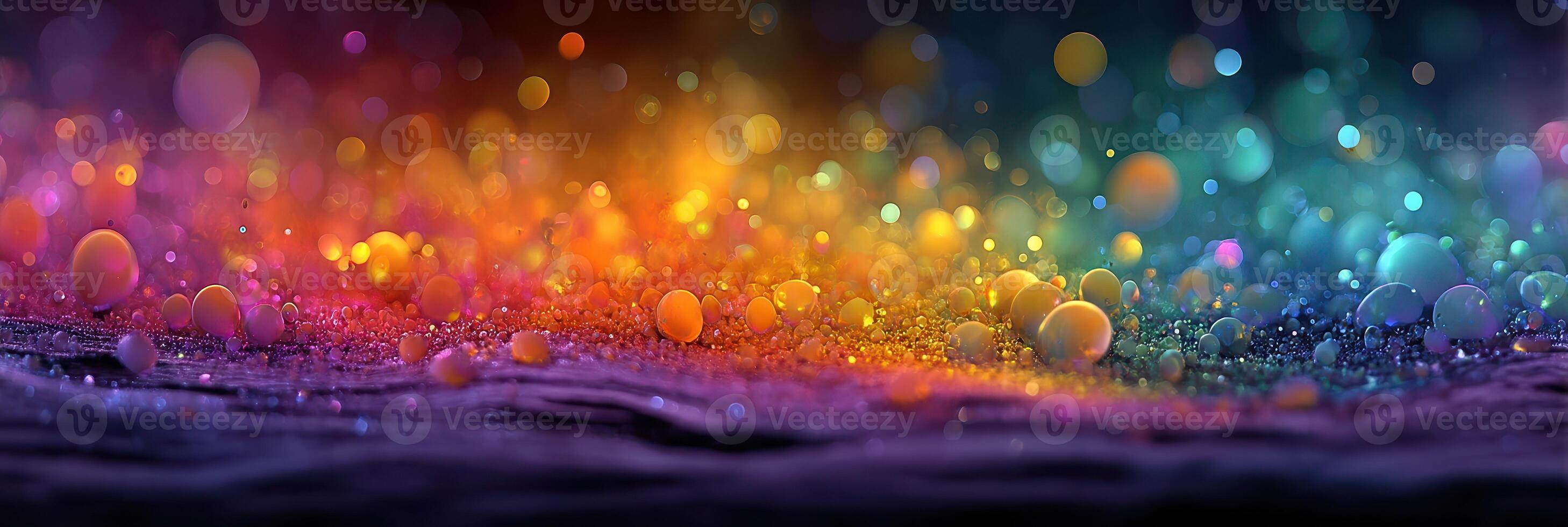 Vibrant colors blend together in a beautiful display of shimmering droplets on a textured surface at dusk photo