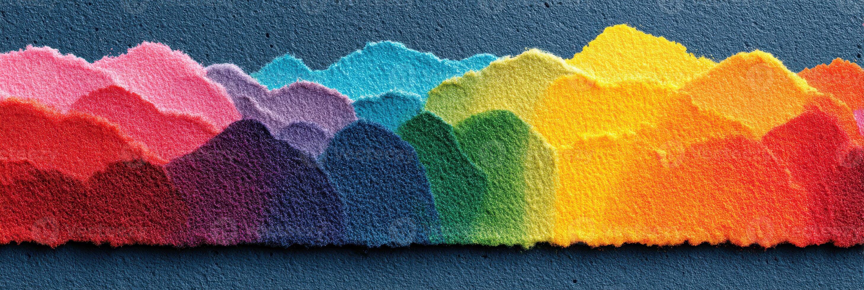 Colorful layered paper mountains create a vibrant landscape on a textured background in an artistic display photo