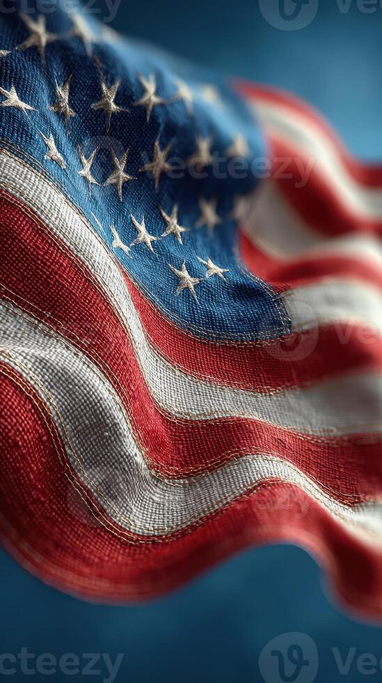 American flag waving proudly against a blue background, showcasing its vibrant colors and intricate details, symbolizing national pride and unity photo