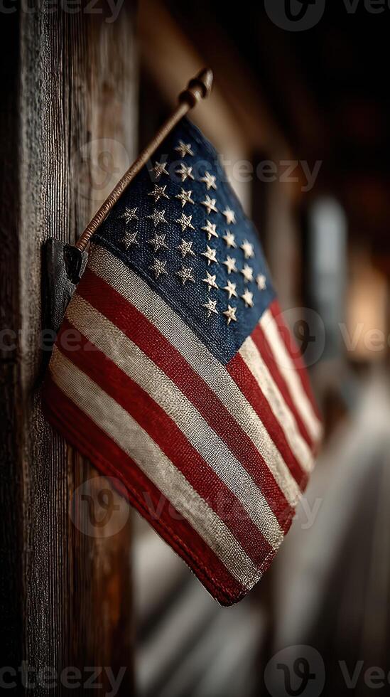 American flag displayed on a wooden wall in a rustic setting during twilight hours photo