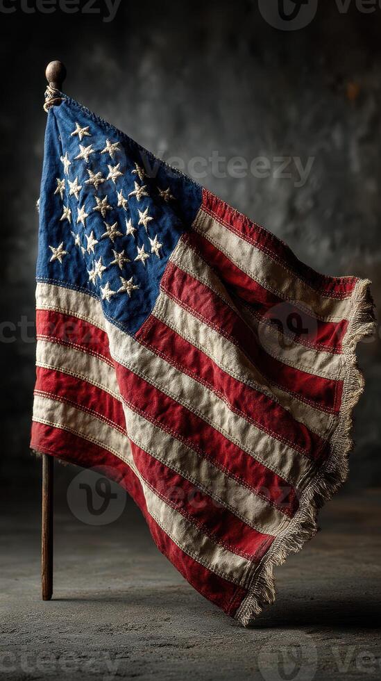 Vintage American flag on display with frayed edges, capturing a sense of history and patriotism in a rustic setting photo