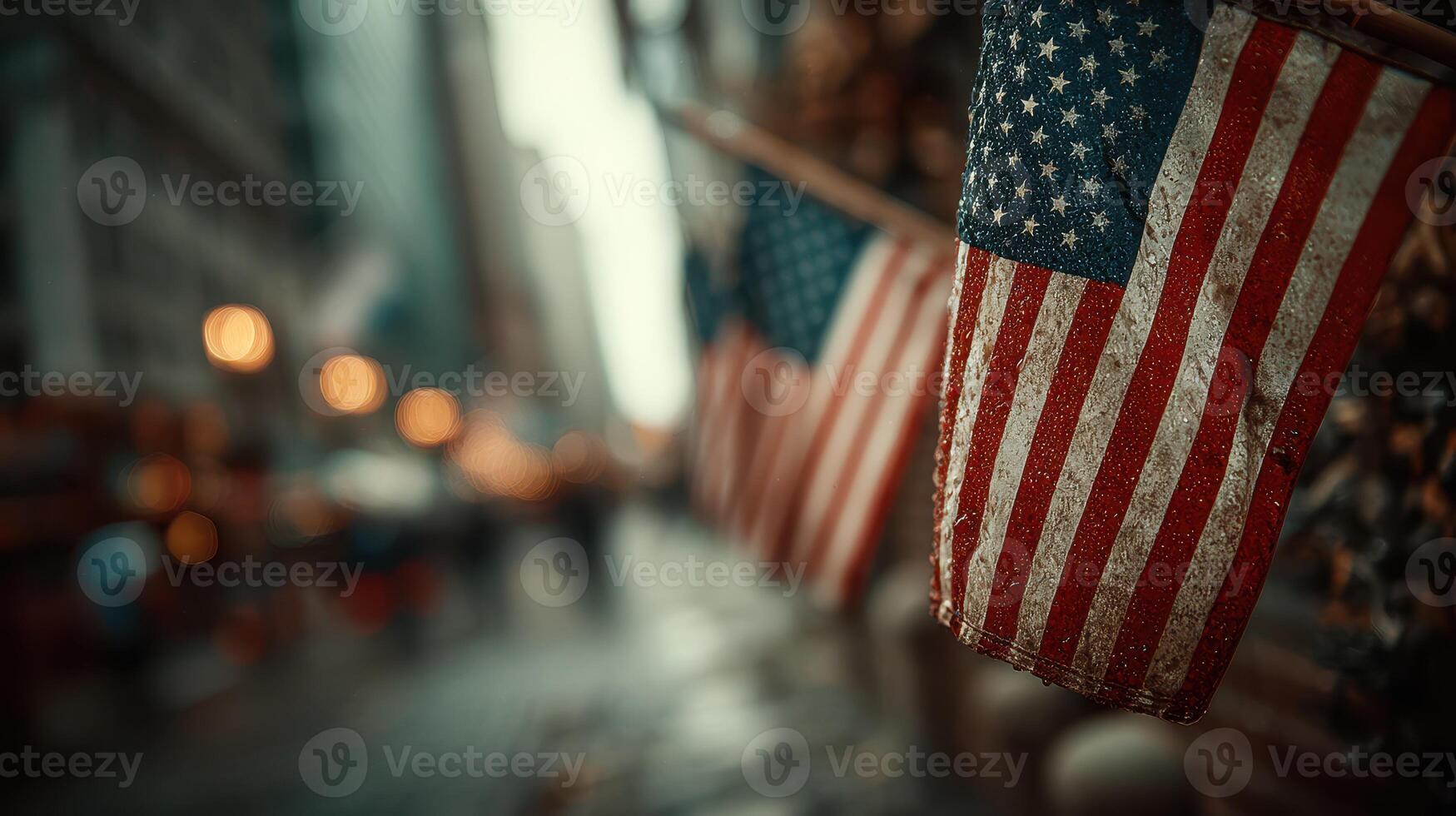 American flags adorn the streets of a busy city during a rainy evening, reflecting national pride and urban life photo