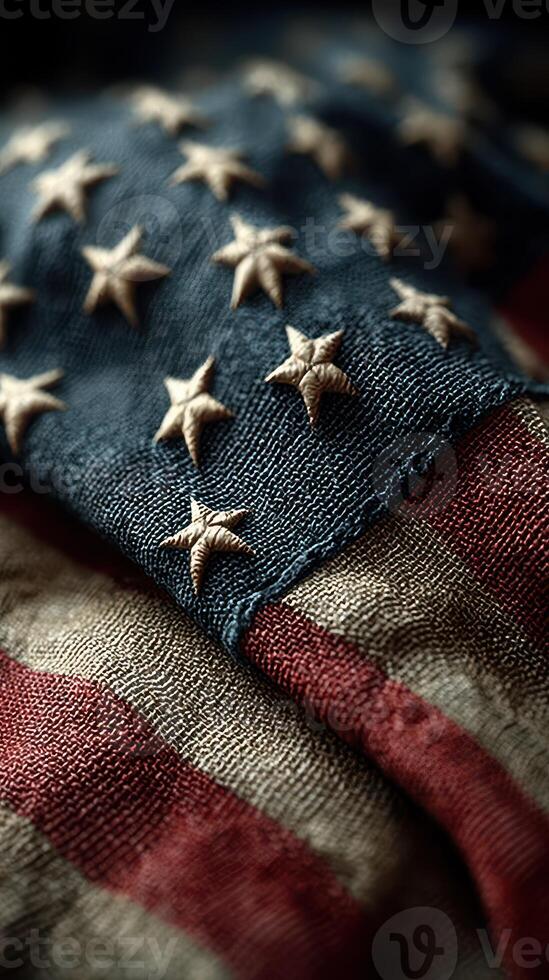 Worn American flag showcasing texture and craftsmanship with stars and stripes in detail photo