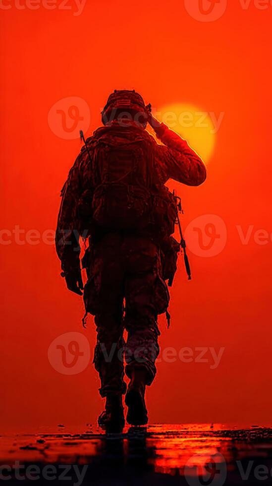Soldier salutes the setting sun, symbolizing respect and honor during twilight in a military setting photo
