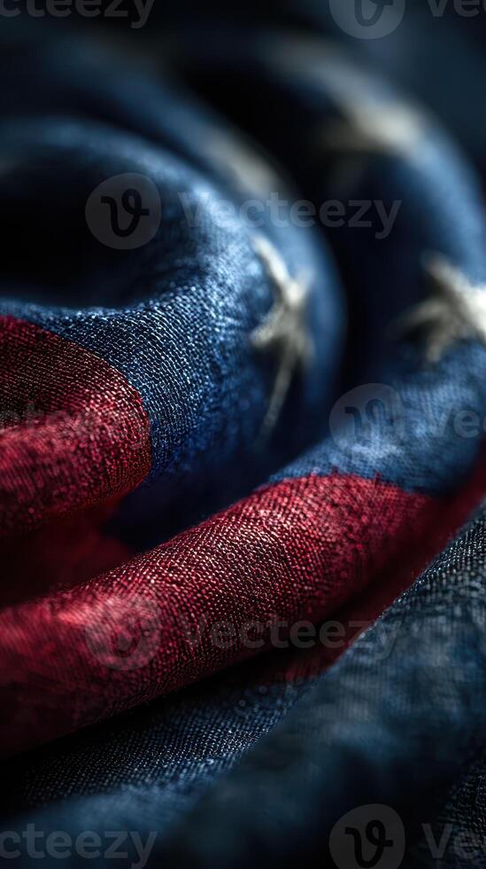 Close-up view of a vintage American flag fabric showcasing intricate details and vibrant colors in soft natural light photo
