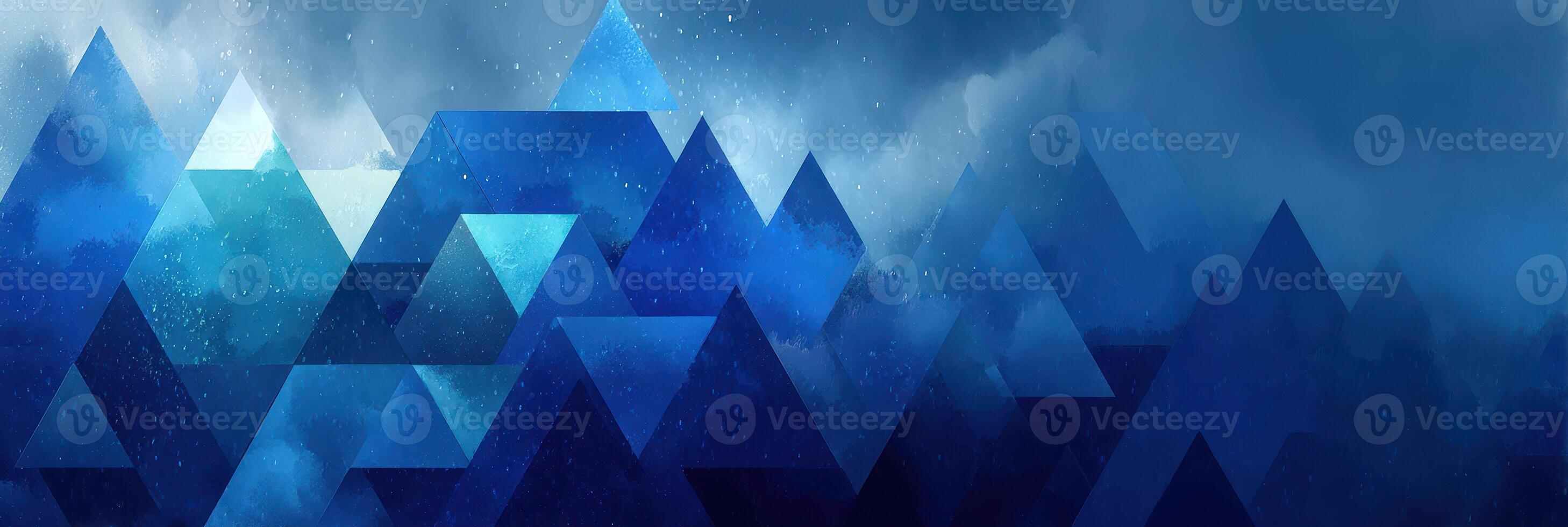 Geometric mountains in deep blue hues with misty clouds creating a serene atmosphere photo
