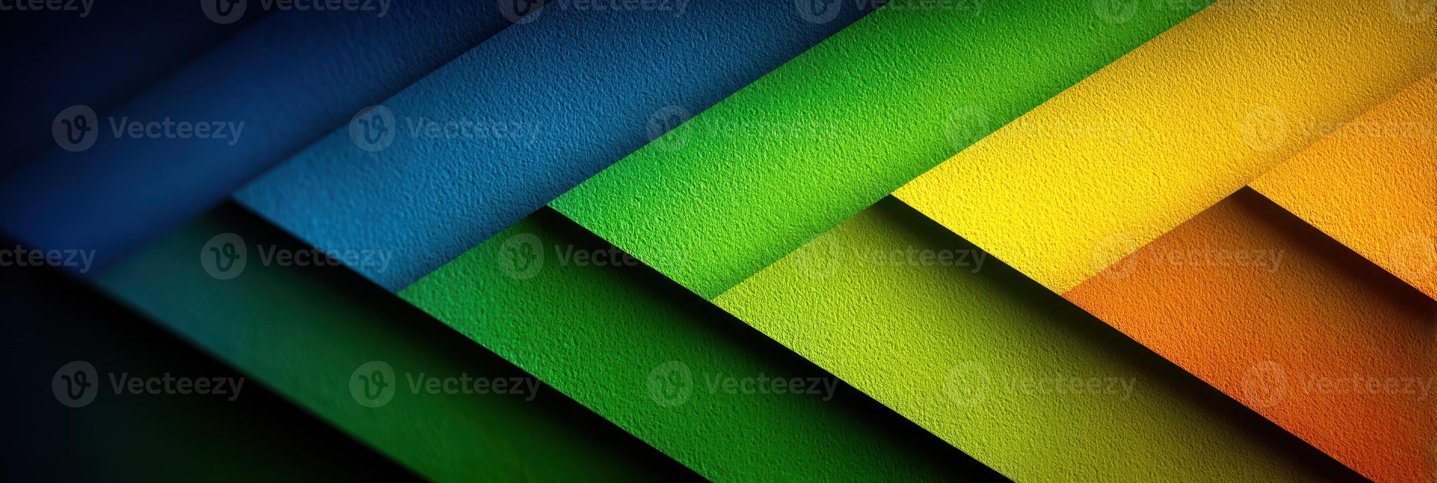 Colorful layers of paper create a vibrant background showcasing varying shades of blue, green, yellow, and orange in a modern design photo