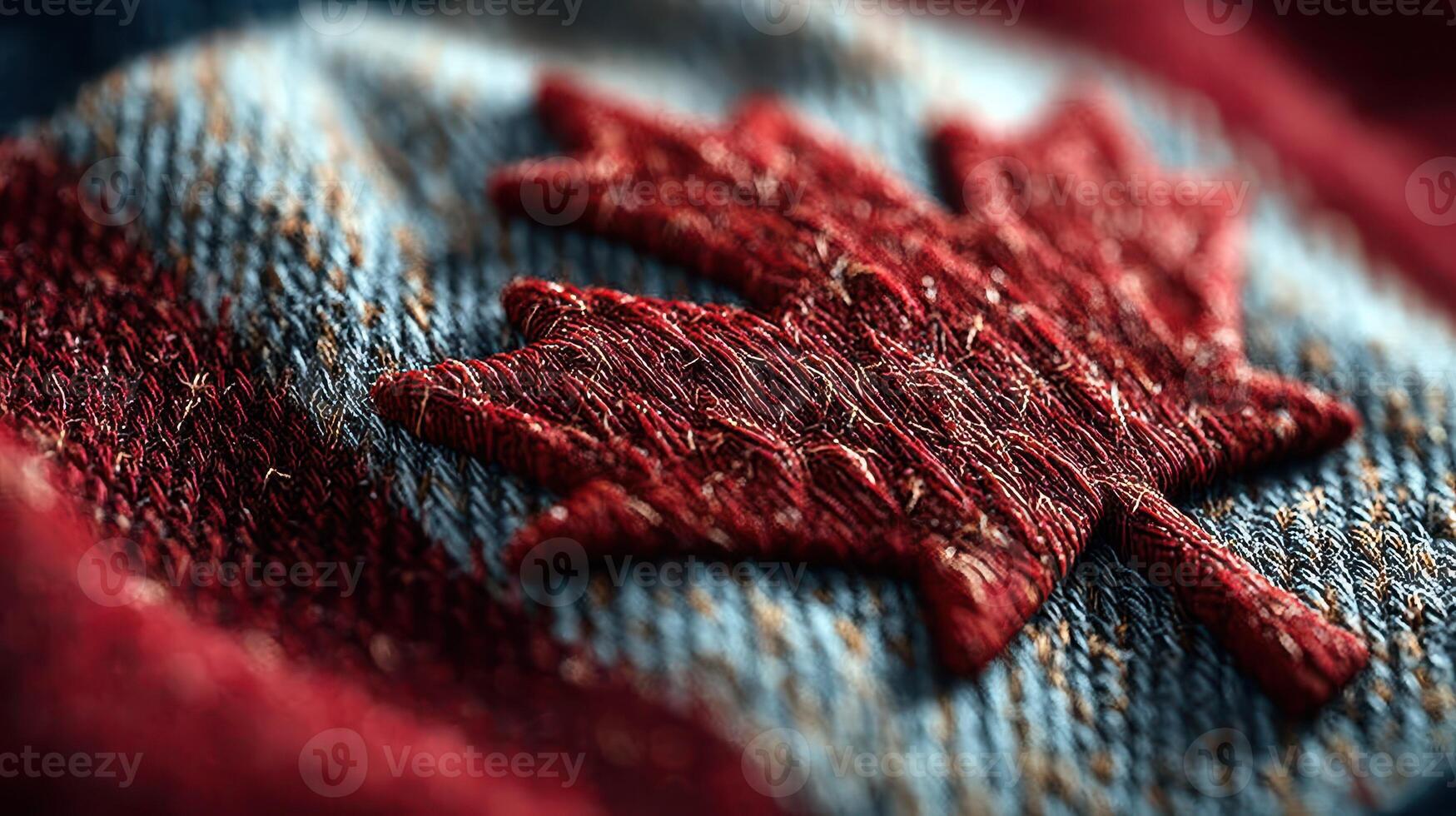 Textured close-up of a maple leaf emblem stitched onto denim fabric showcasing Canadian symbolism and craftsmanship photo