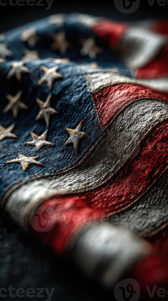 Old American flag with textured fabric details representing history and pride captured in artistic light photo