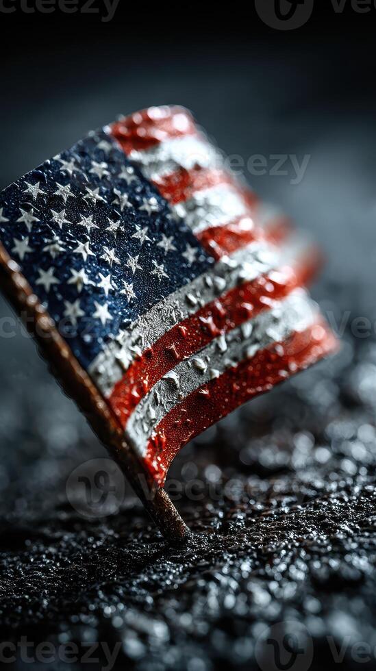 American flag pin resting on textured surface with dramatic lighting creating a striking visual effect photo