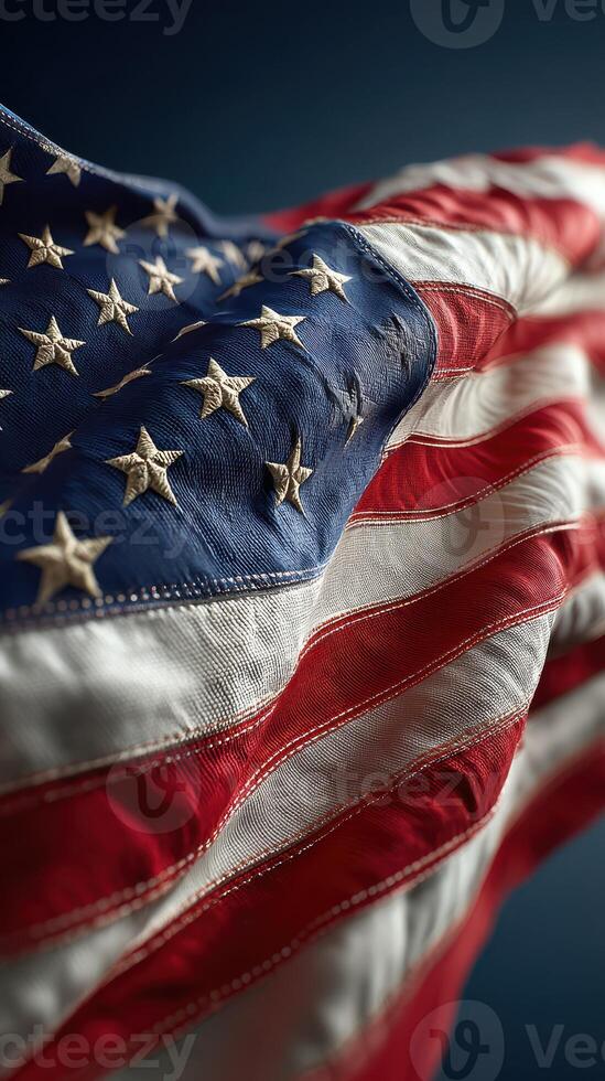 Waving American flag with stars and stripes displayed in detailed close-up under soft lighting photo
