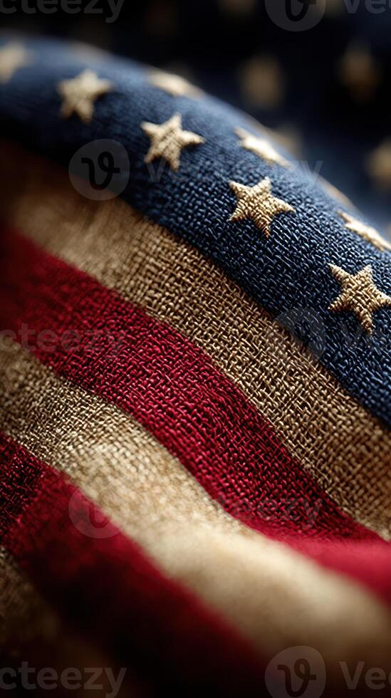 Detail of an American flag fabric showcasing red, white, and blue with stars and stripes in a close-up shot at twilight photo