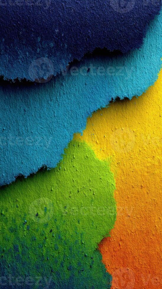 Colorful layers of textured paper create a vibrant abstract background with blue, green, and orange shades photo