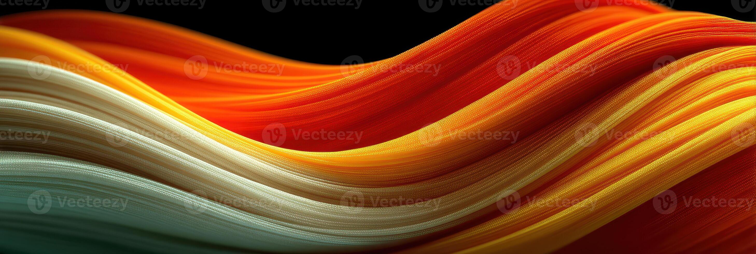 Colorful waves of fabric flowing gracefully against a dark background create a captivating visual experience in this artistic representation photo