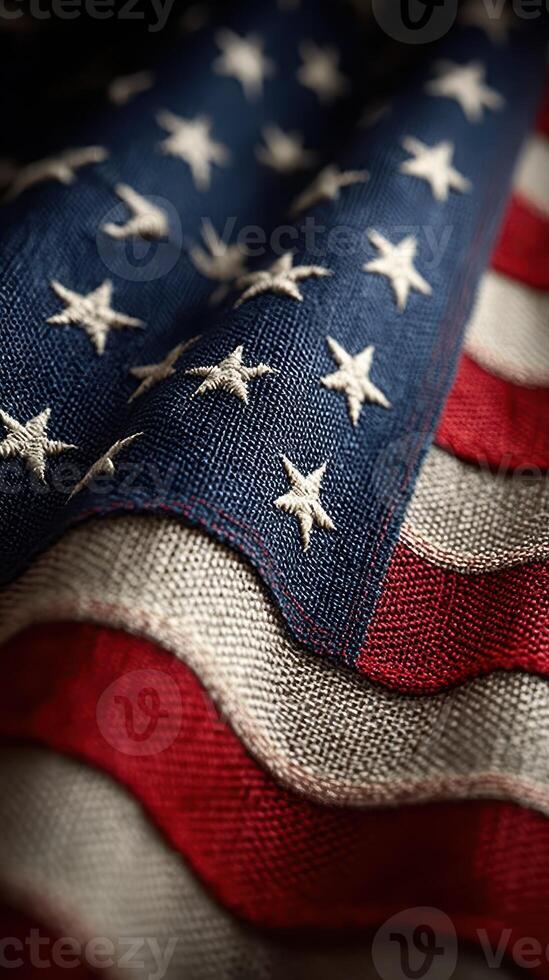 Waving fabric of an American flag displaying stars and stripes with intricate details and rich colors photo