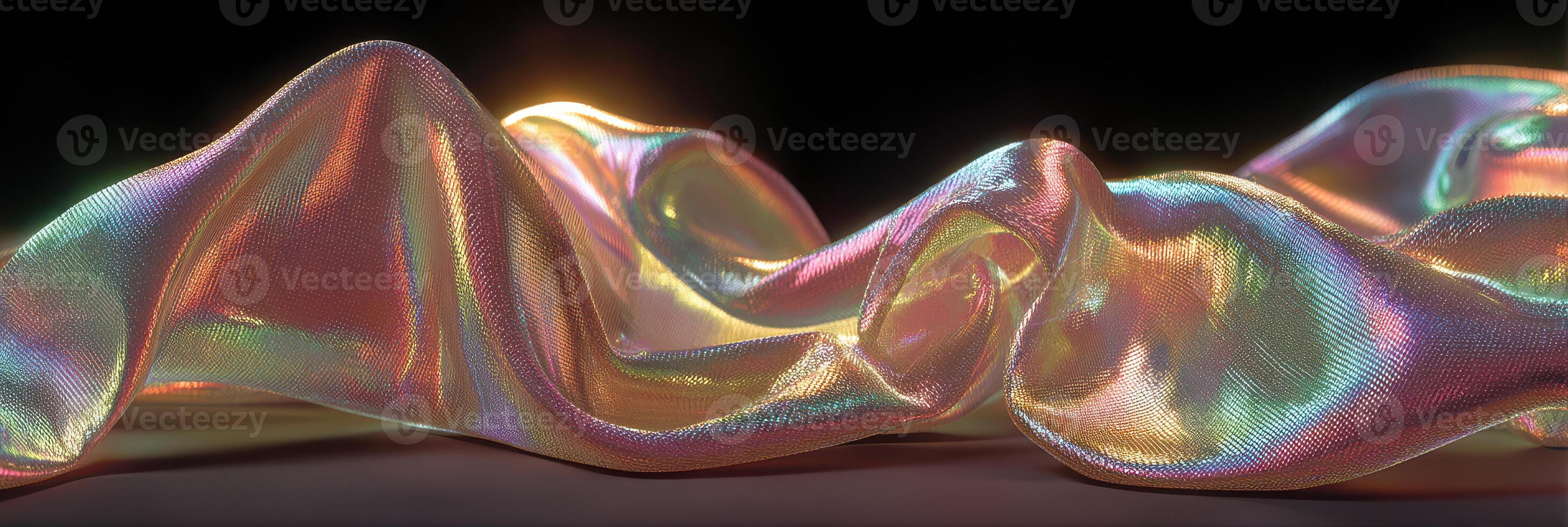 Colorful silk fabric draped artistically with shimmering highlights in a dark setting photo