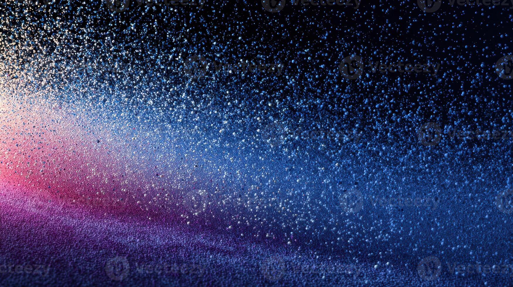 Colorful water droplets create a mesmerizing gradient effect against a dark background photo