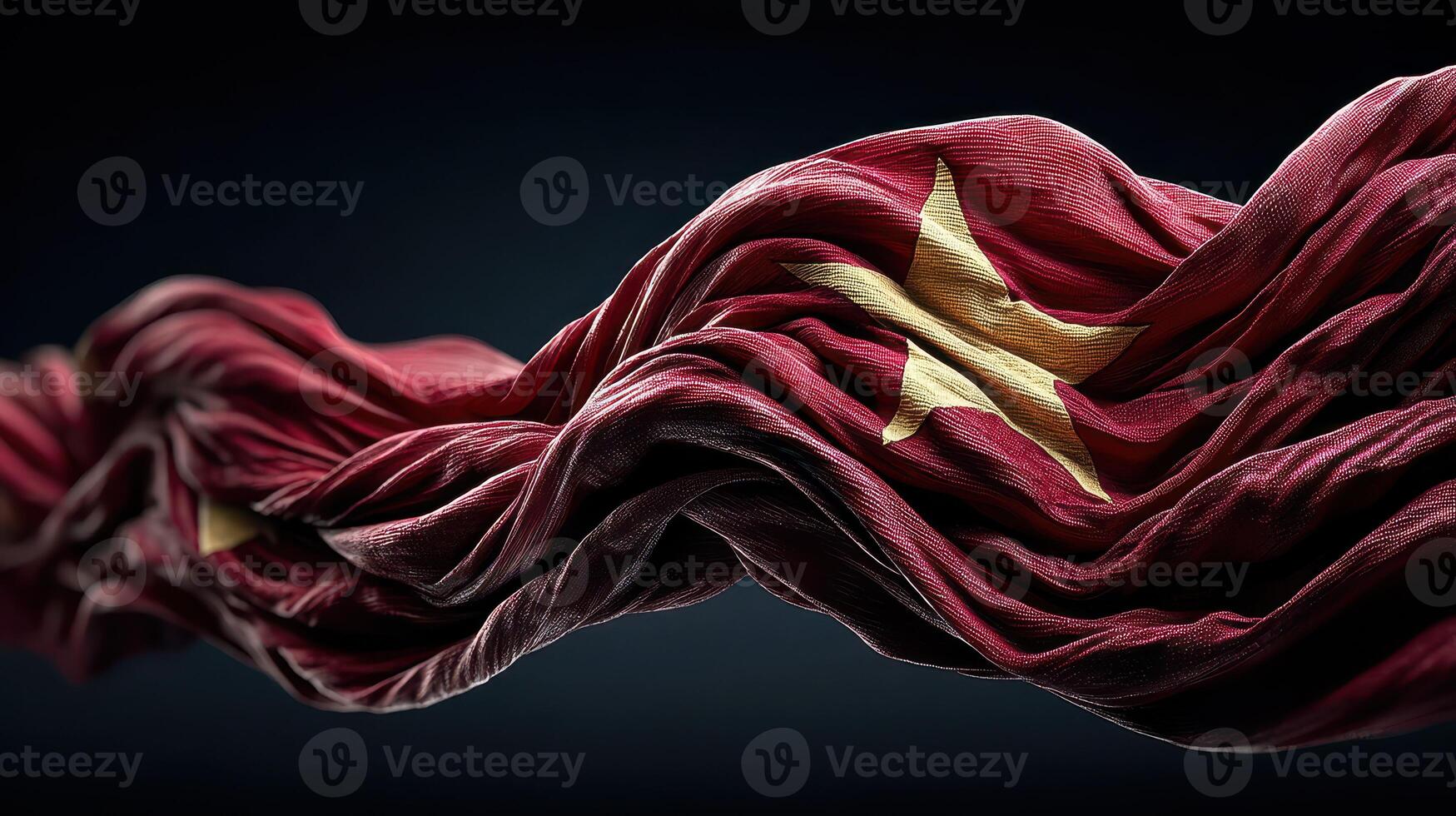 Red flag with golden star waves gracefully against a dark background conveying a sense of strength and identity photo