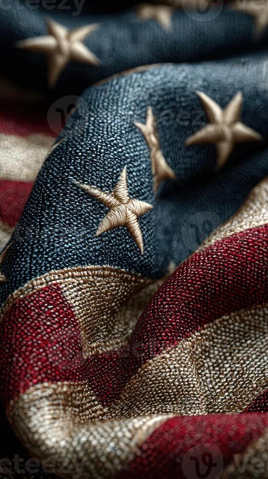 Close-up view of a textured American flag fabric featuring stars and stripes in rich colors photo
