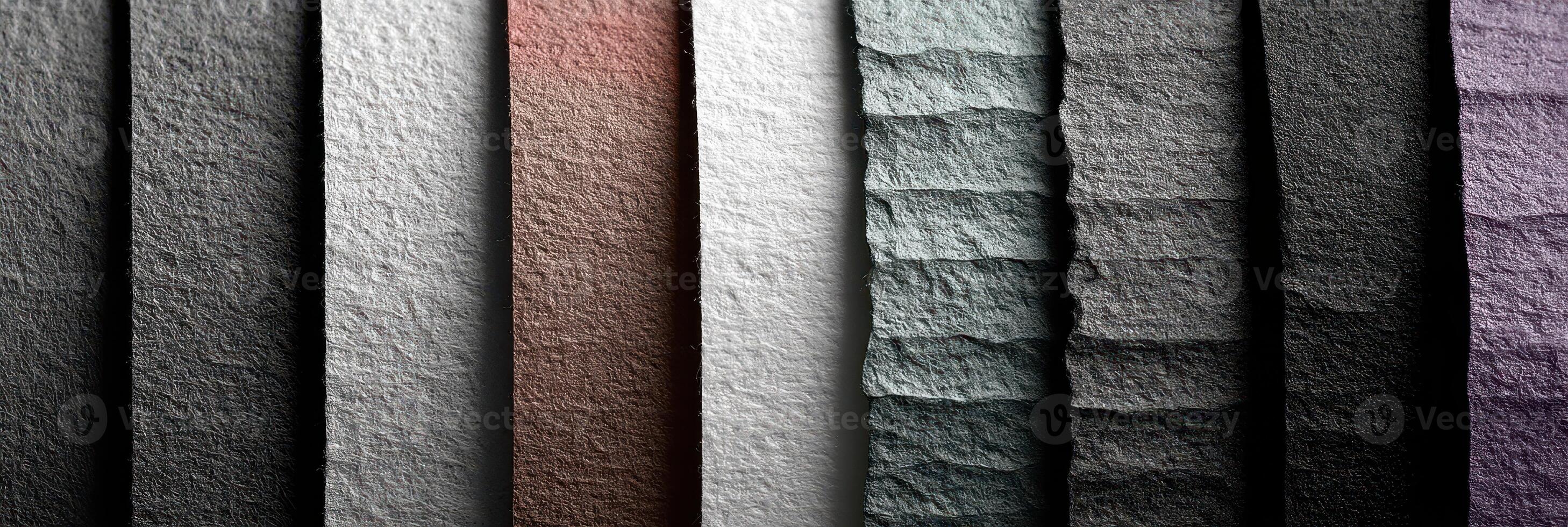 Colorful textured paper displays arranged vertically in an artistic composition showcasing various shades photo