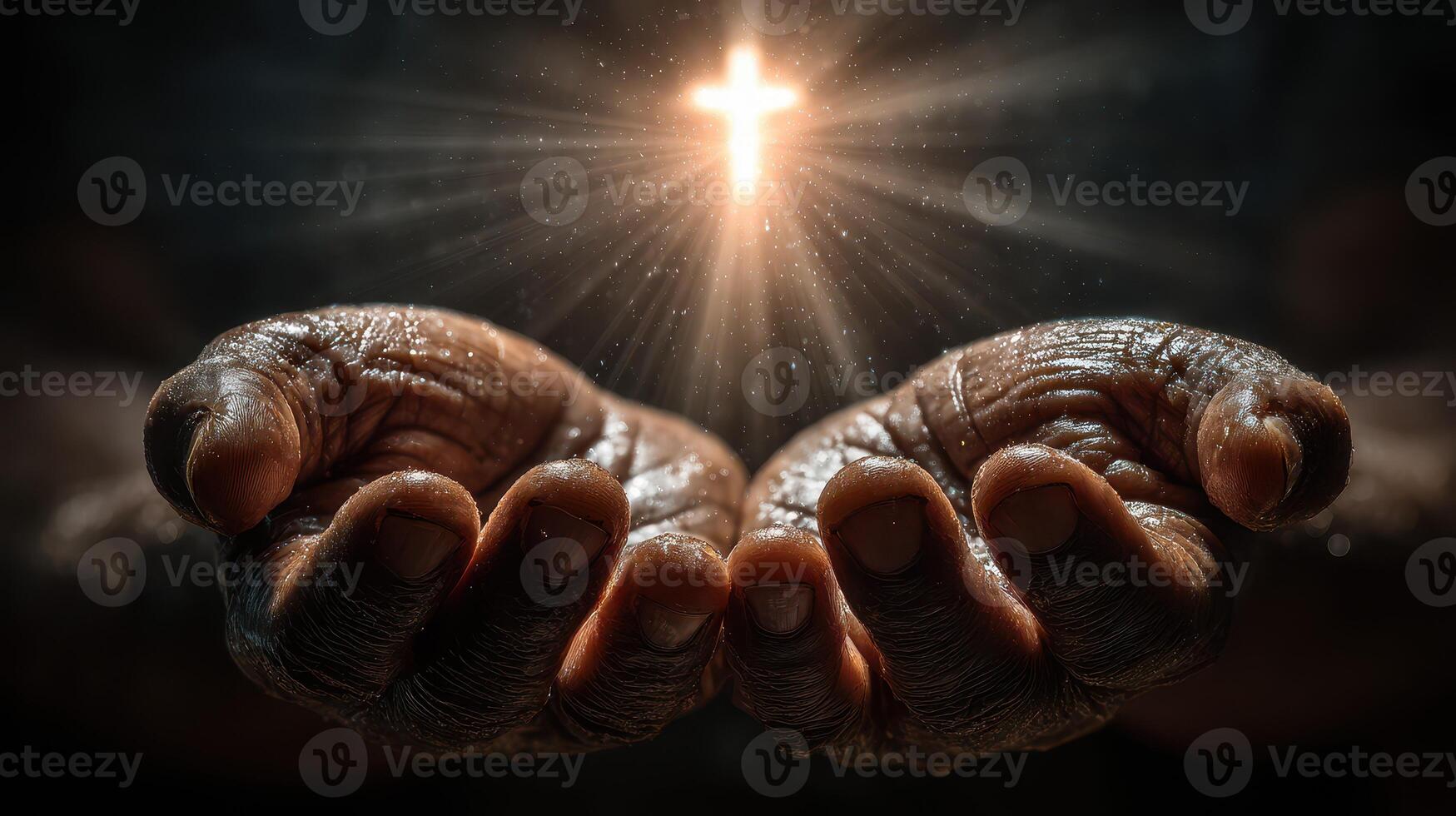 Hands reaching out in prayer with a glowing cross above them during a moment of spiritual reflection photo