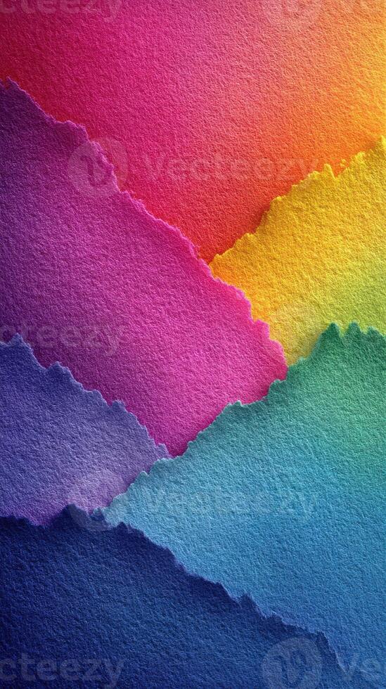 Colorful layers of torn paper create a vibrant abstract landscape in shades of purple, blue, and yellow photo