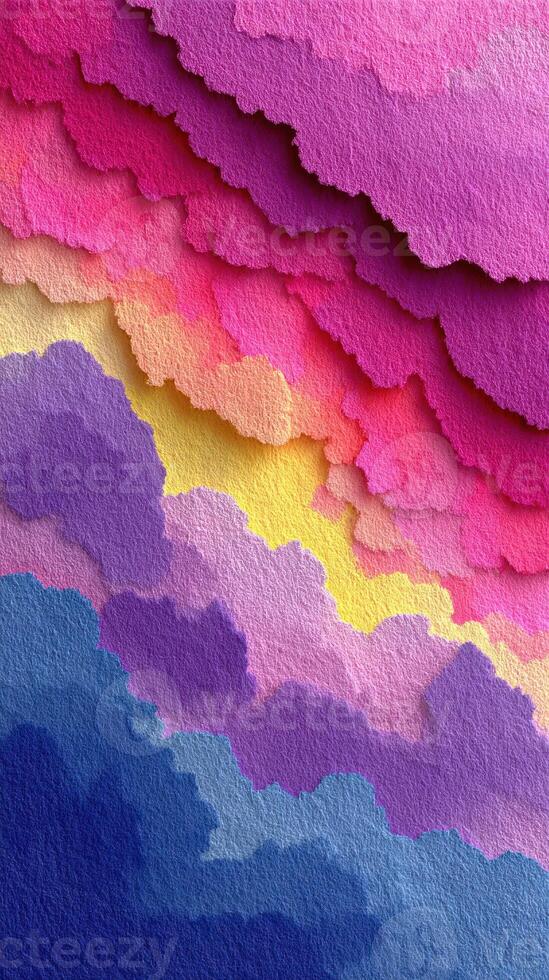 Colorful layers of paper create a vibrant abstract landscape in shades of pink, yellow, and blue photo
