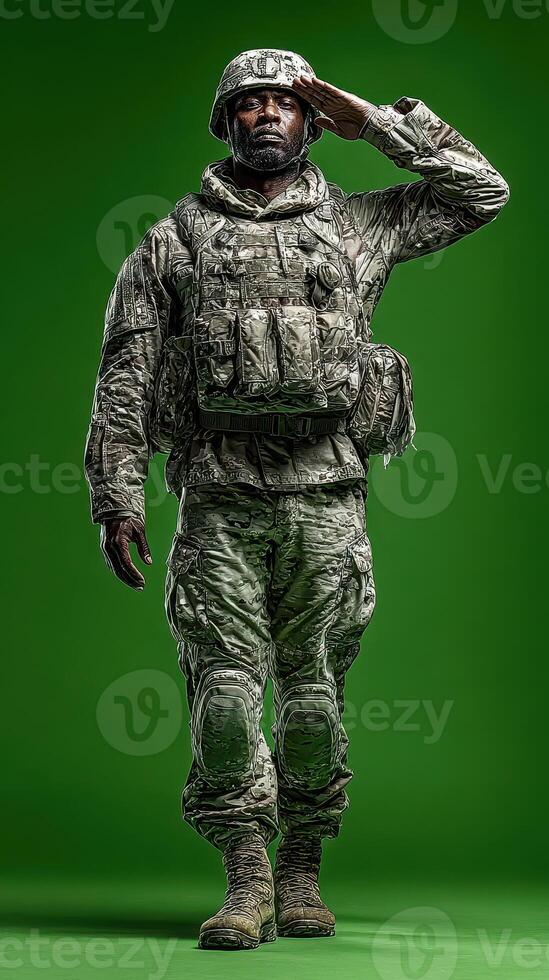 Soldier saluting with respect and pride in military uniform against a solid green background photo