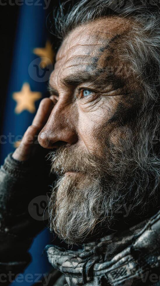 Portrait of a bearded man saluting against a backdrop of stars and stripes, showcasing resilience and determination photo