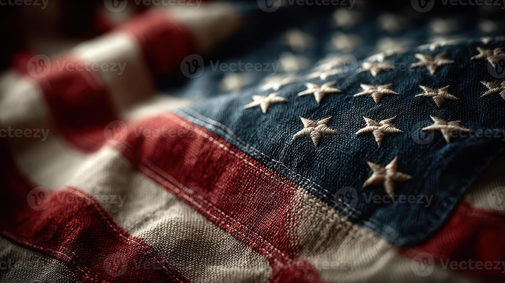 Close-up view of an American flag featuring intricately stitched stars and stripes in natural light photo