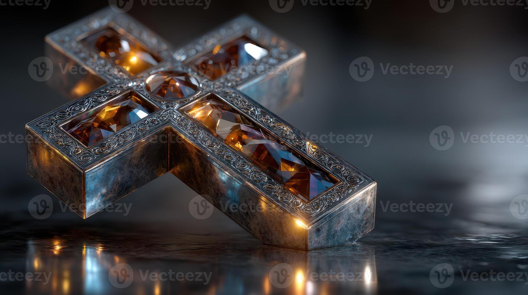 Decorative cross with intricate detailing and sparkling gems in close-up view on a dark surface photo
