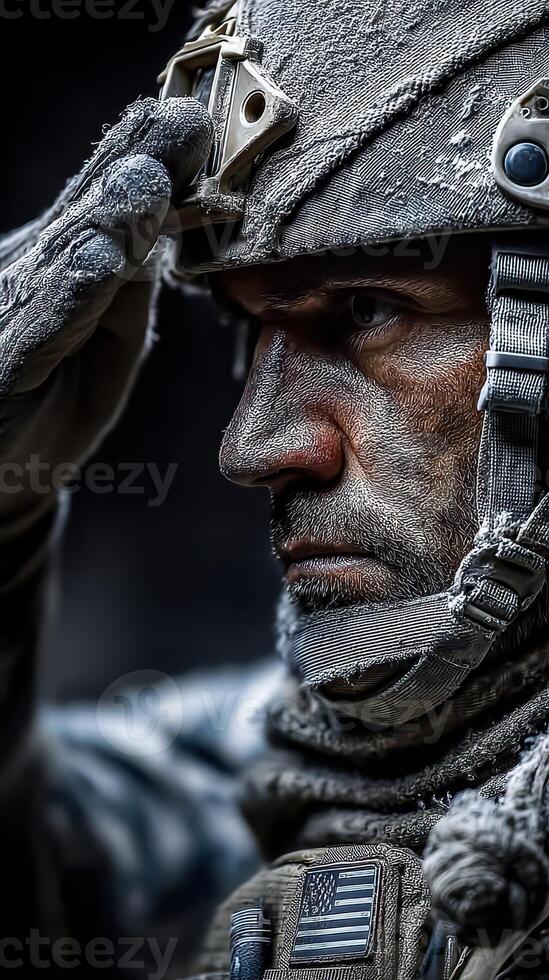 Soldier performing a salute during a military ceremony in a cold, rugged environment at dusk photo