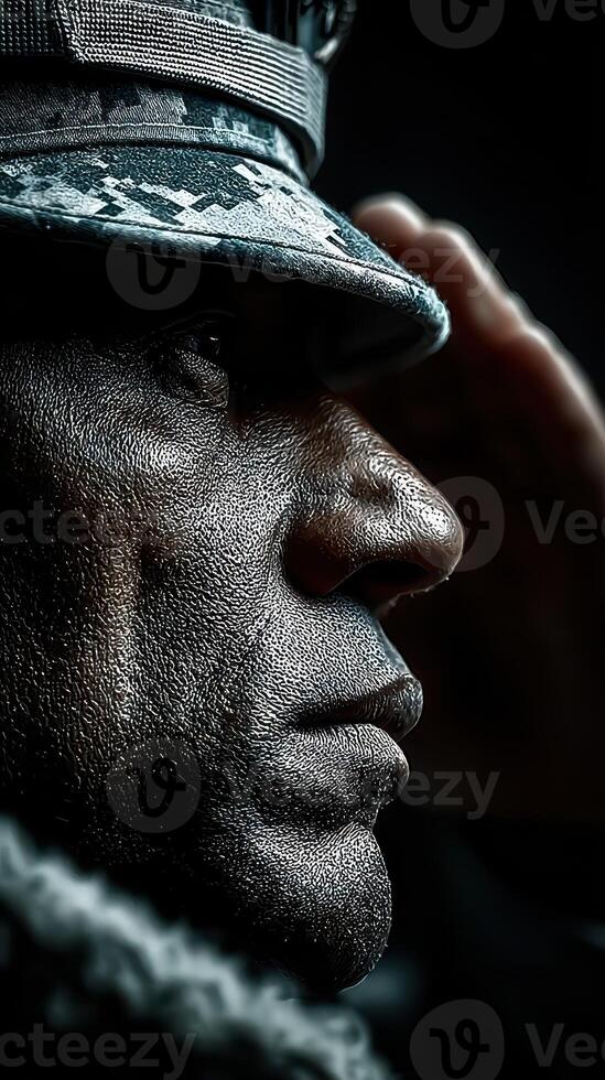 Saluting soldier with strong expression in uniform during a ceremony indoors under low lighting conditions photo