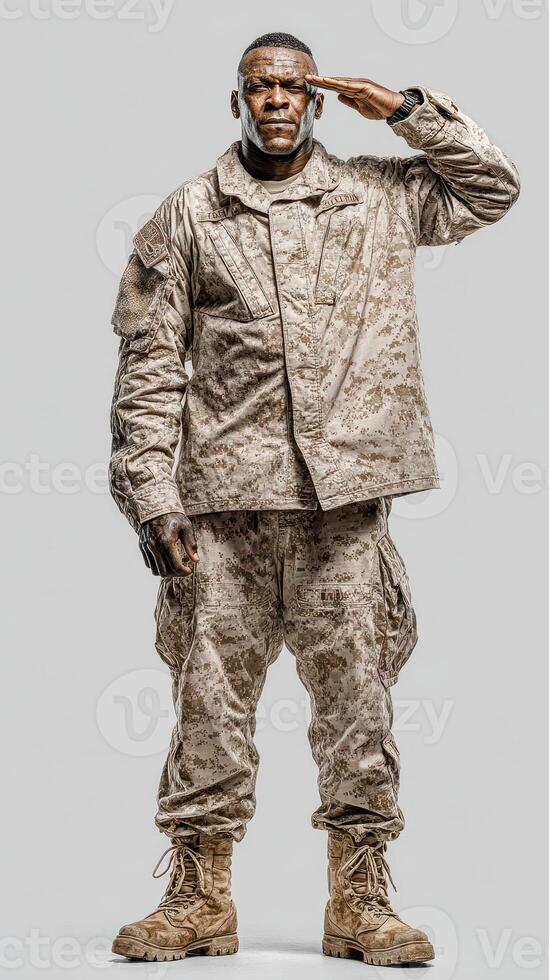 Military personnel performs a salute in desert camouflage uniform indoors during a ceremonial event photo