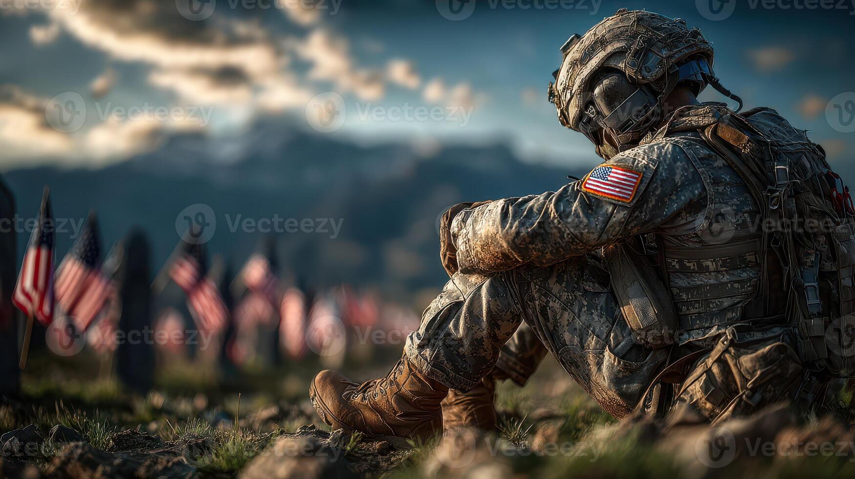 Soldier reflecting in a cemetery surrounded by American flags during sunset in a peaceful mountainous area photo