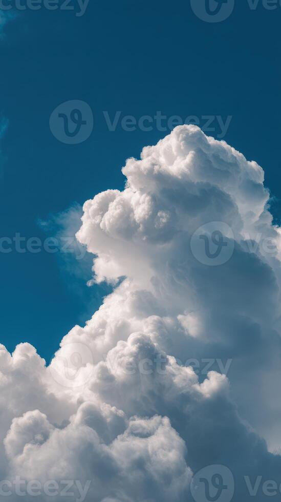 Majestic white clouds fill the bright blue sky at midday creating a stunning natural display of shapes and textures photo