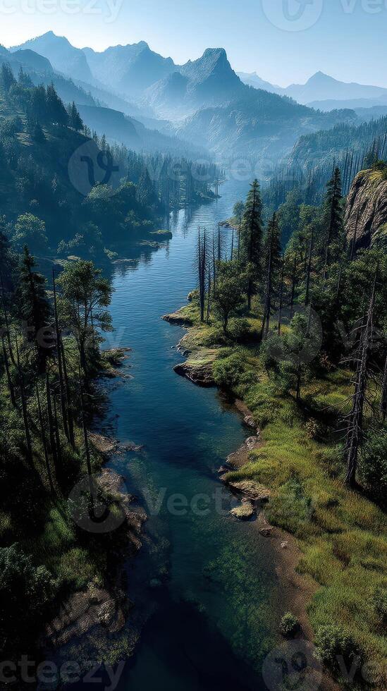 Mountain river winding through forests and valleys in early morning light under a clear sky photo