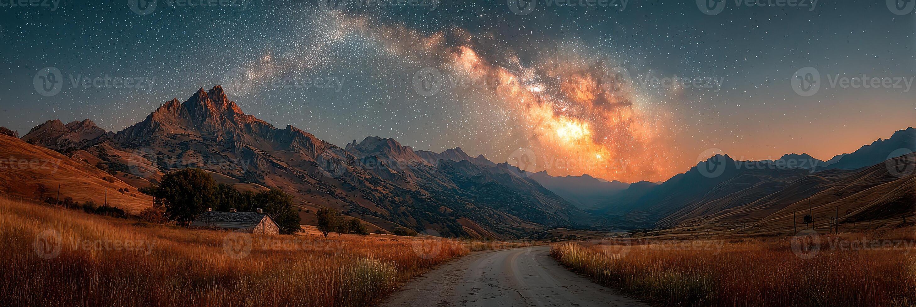Stunning view of the Milky Way over mountains at dusk in a serene valley photo