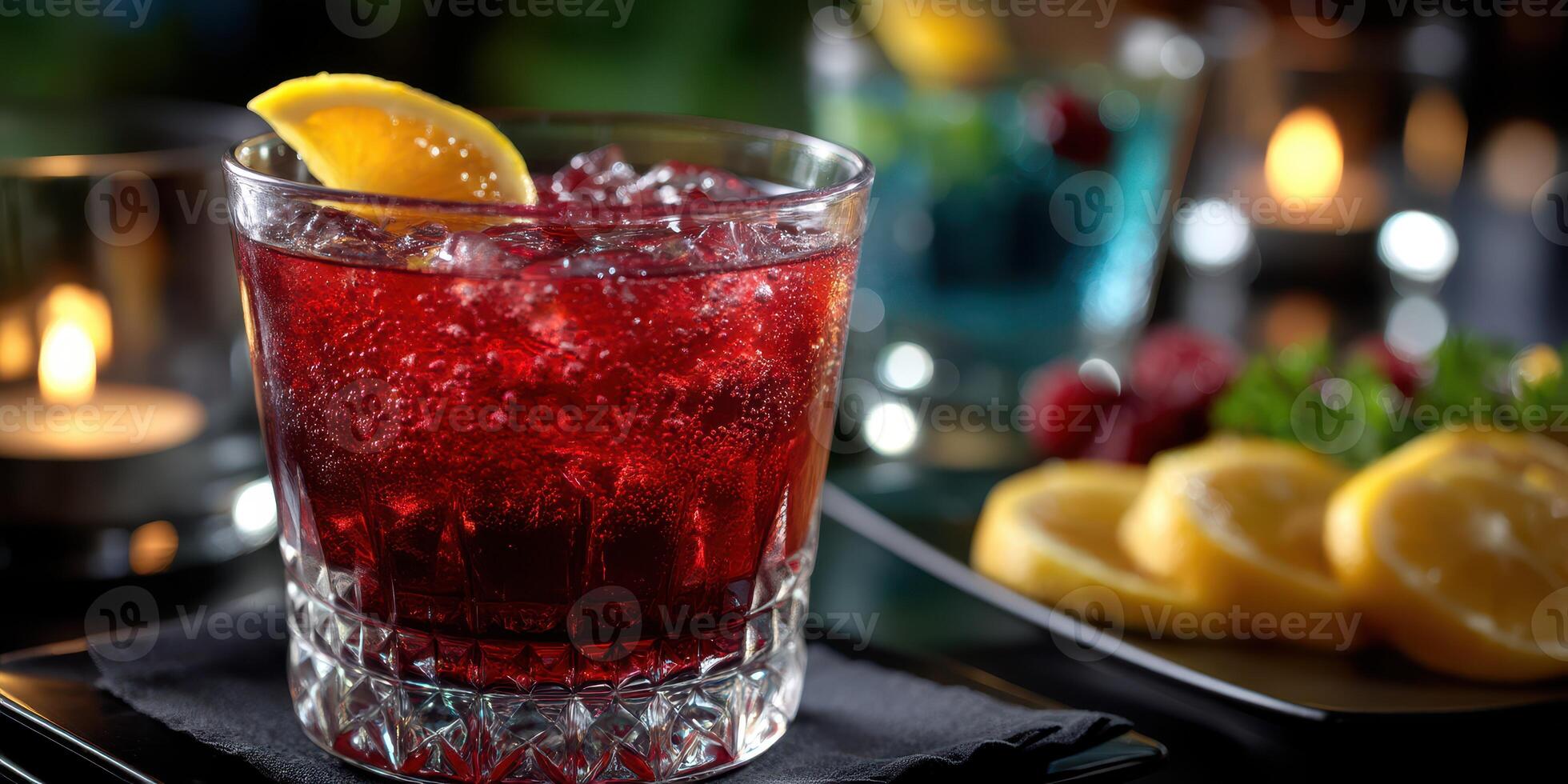 Refreshing cocktail with vibrant red hue garnished with lemon slices served in an elegant setting at a bar photo