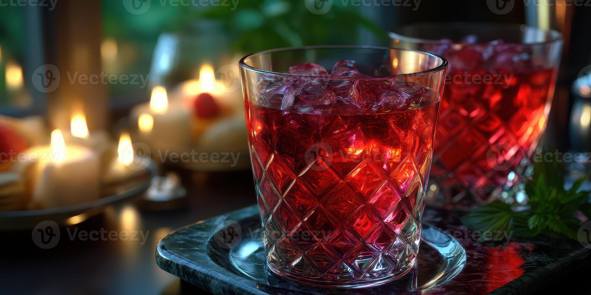 Refreshing red beverages served chilled with candlelight ambiance in a cozy setting photo