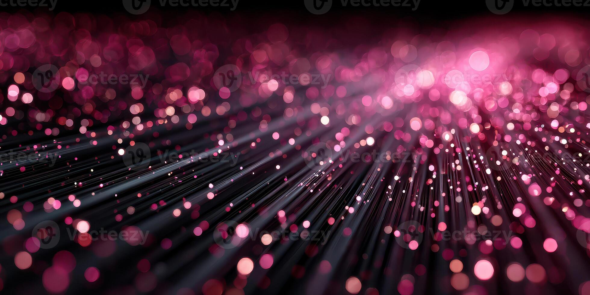 Beautiful pink glitter particles sparkle on a dark background, creating a stunning visual effect for an enchanting atmosphere photo