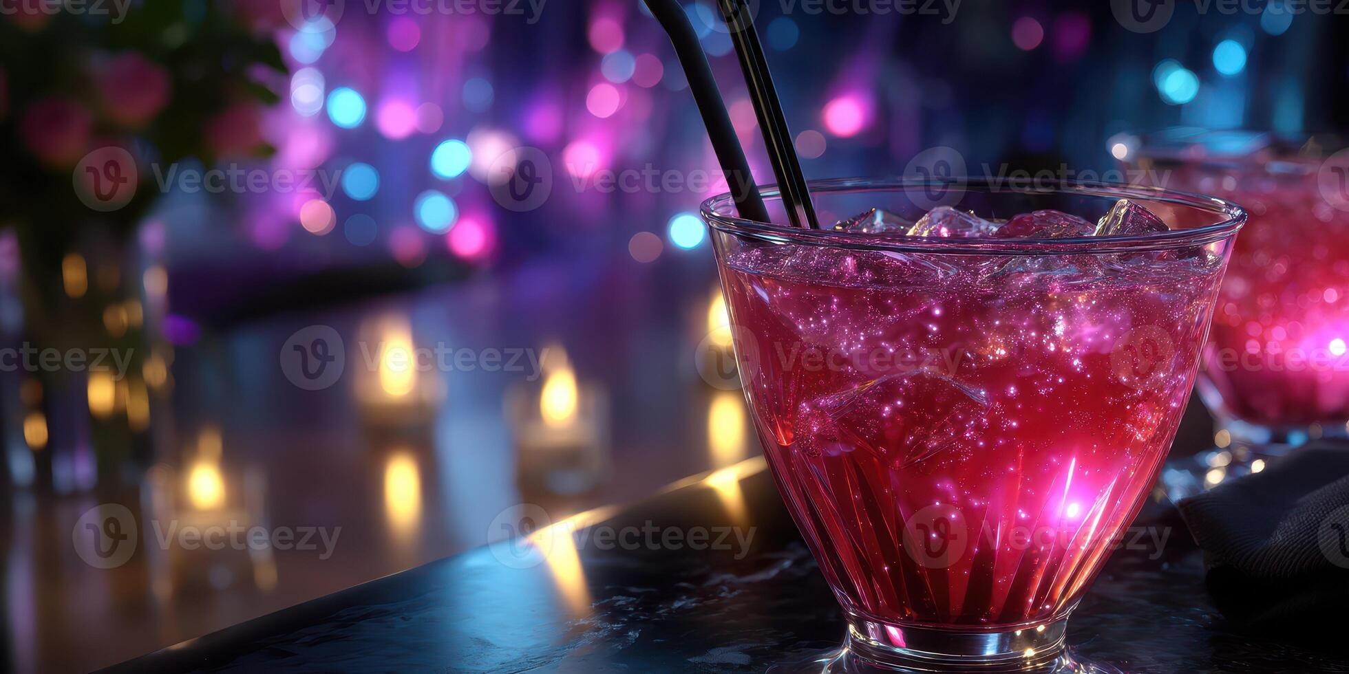 Vibrant cocktail with ice illuminated by colorful lights at a festive bar during evening hours photo