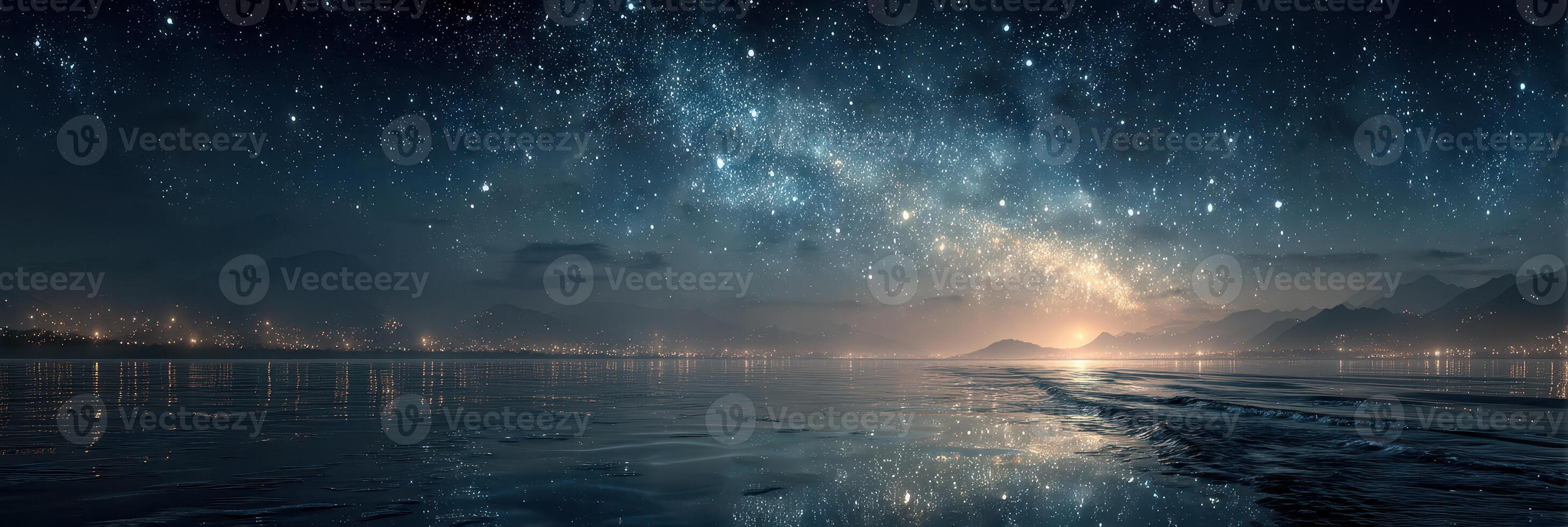 A stunning night sky illuminates a tranquil ocean reflecting stars and city lights near the coast photo