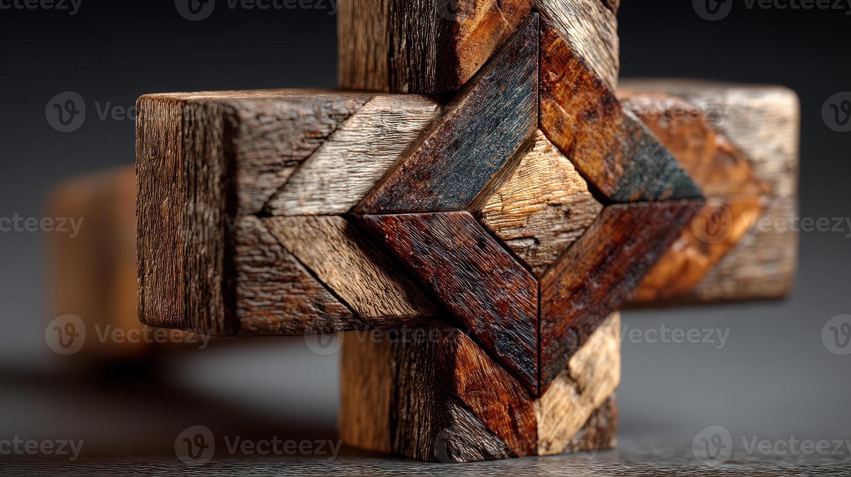 Intricately crafted wooden cross with geometric patterns displayed on a dark background photo