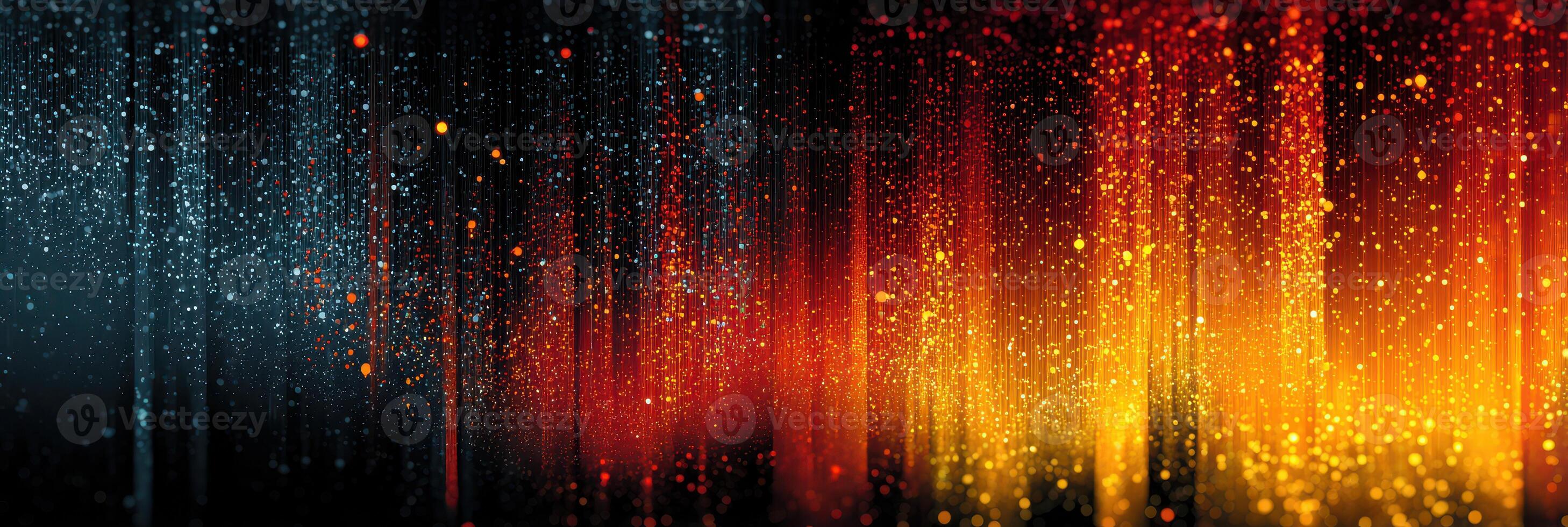 Light patterns create an abstract display of colors resembling fire and water droplets at night photo