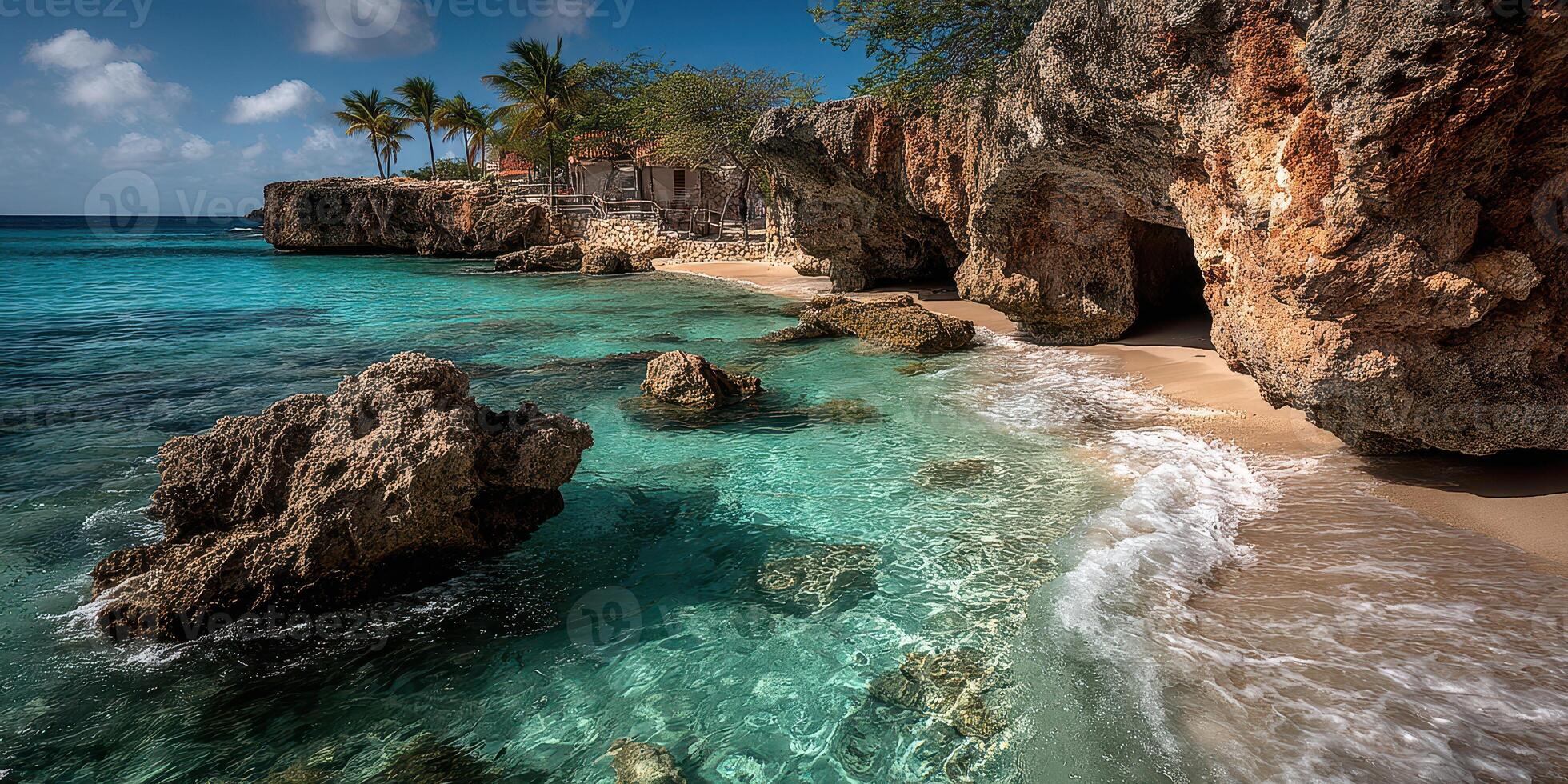 Serene tropical coastline with clear waters and rocky outcrops under a bright blue sky photo