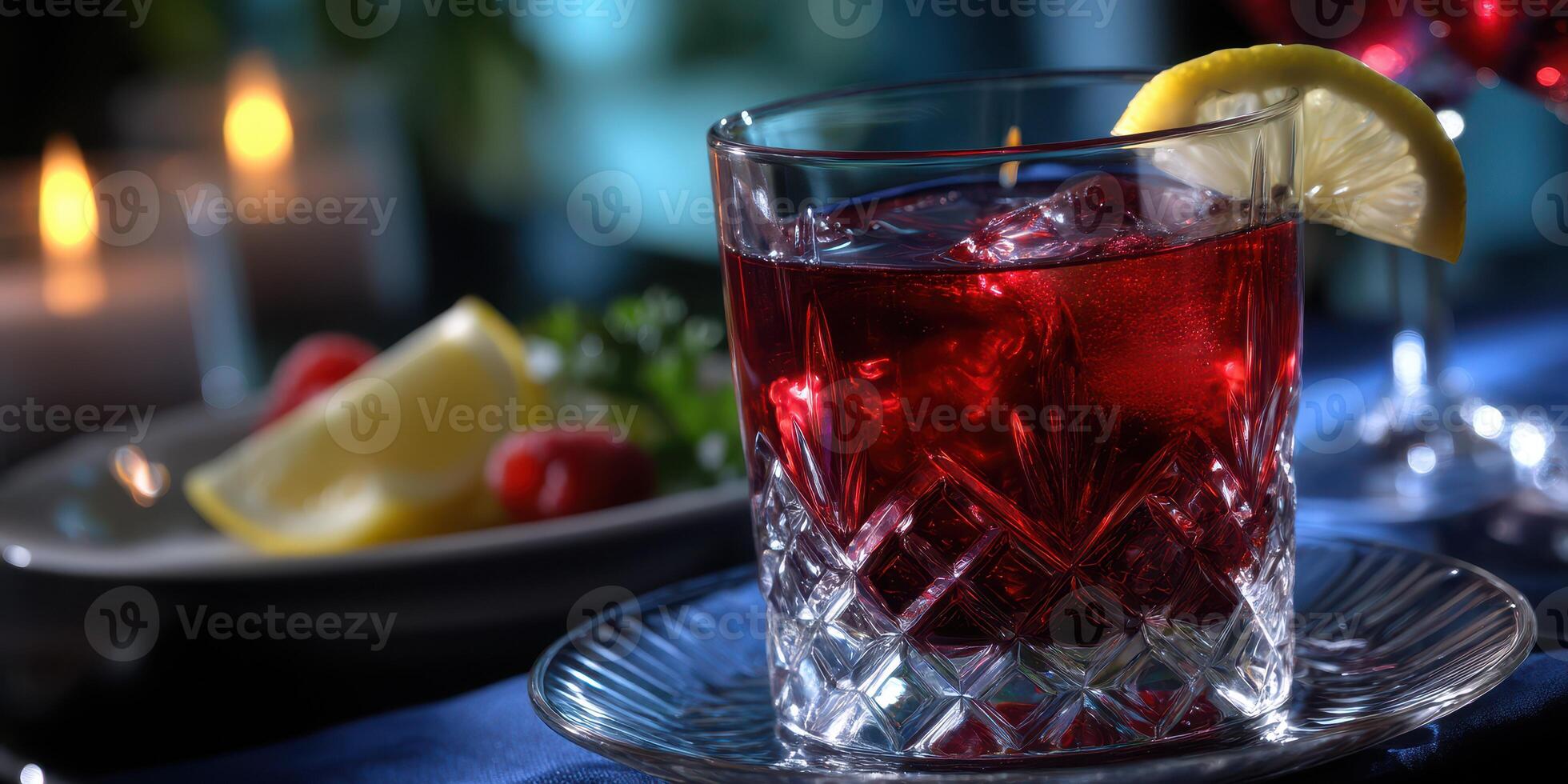 Refreshing beverage with ice and garnish in an elegant setting during evening dining photo